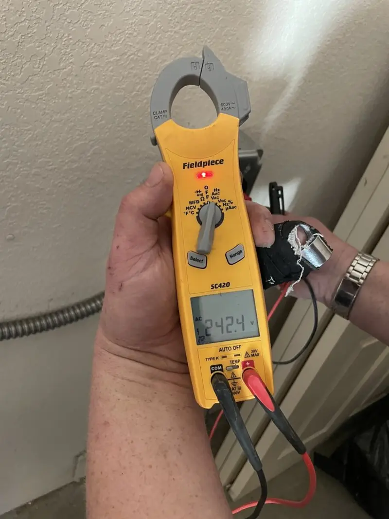Voltage testing with clamp meter during Recessed Lighting Installation in Chesapeake